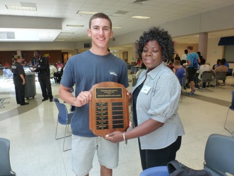 The 2014 scholarship winner was Anthony Grecco, he is pictured with Tracey Penny, Department Chair of Academic Affairs.